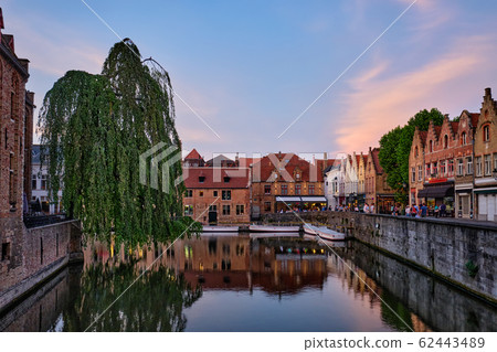Bruges canal and houses at sunset. Brugge famous place, Belgium 62443489