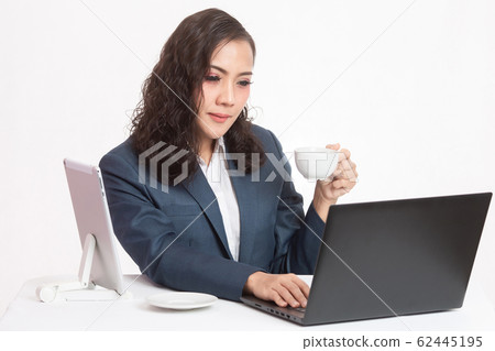 Beautiful young executive with her work and coffee 62445195