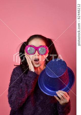 Surprised asian woman, Shouting girl wearing funny glasses on isolated pink background. Surprised asian woman, Shouting girl wearing funny glasses on isolated pink background. 62446212