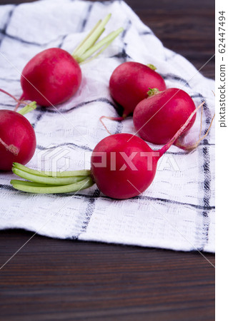 Heap of fresh radishes. Heap of fresh radishes. 62447494