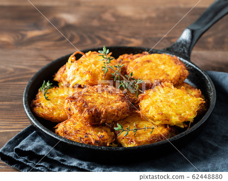 Potatoes pancakes or flapjacks on wooden table 62448880