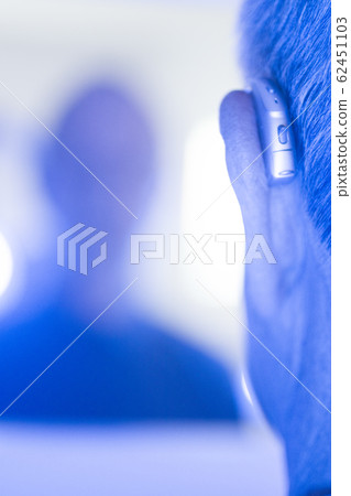 Man with hearing aid Man with hearing aid 62451103