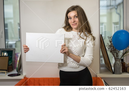 Woman holds an empty canvas with copy space for Woman holds an empty canvas with copy space for 62452163