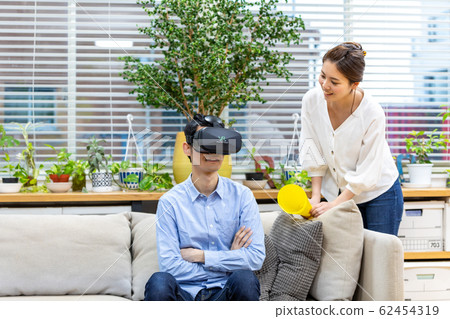 Couple watching sports in VR Couple watching sports in VR 62454319