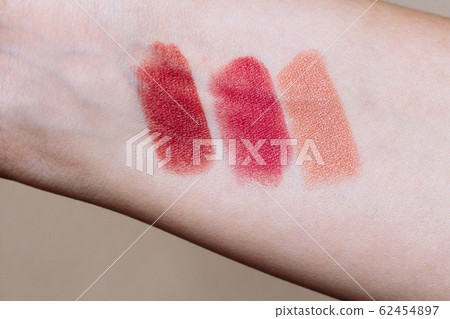Female arm with lipstick tone color and testing different lipsticks, Female arm with lipstick tone color and testing different lipsticks, 62454897