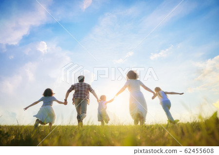 Happy family on summer walk Happy family on summer walk 62455608
