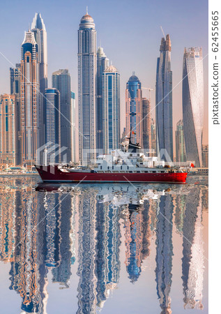 Panorama of Dubai with ship against skyscrapers in UAE Panorama of Dubai with ship against skyscrapers in UAE 62455665