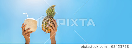 Panoramic photo of Hands Holding Fruits in Tropical Paradise Over Sky Background Panoramic photo of Hands Holding Fruits in Tropical Paradise Over Sky Background 62455758