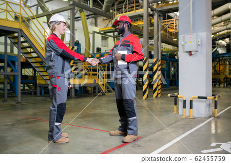 Factory Workers Greeting Each Other Factory Workers Greeting Each Other 62455759