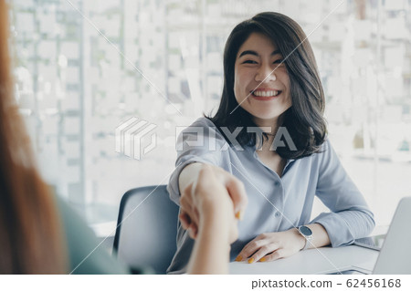 Businessmans handshake after good deal. 62456168