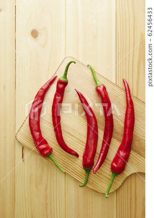 Chili pepper wood grain background Chili pepper wood grain background 62456433