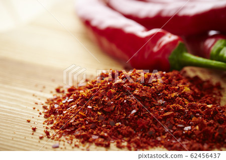 Chili pepper wood grain background Chili pepper wood grain background 62456437
