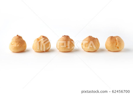 Side by side cream puffs french sweets white background 62456700