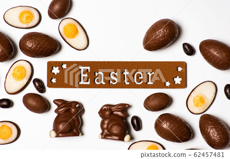 Easter background card with chocolate eggs 62457481
