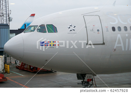 COPENHAGEN, DENMARK - NOV 24th, 2018: SAS Airbus A340 at the departure gate of Copenhagen Kastrup airport before departing to USA COPENHAGEN, DENMARK - NOV 24th, 2018: SAS Airbus A340 at the departure gate of Copenhagen Kastrup airport before departing to USA 62457928