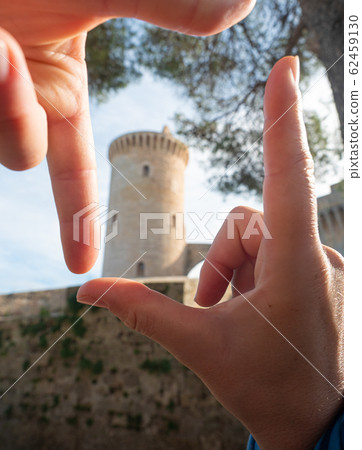 Female finger frame around Castell de Bellver Female finger frame around Castell de Bellver 62459130
