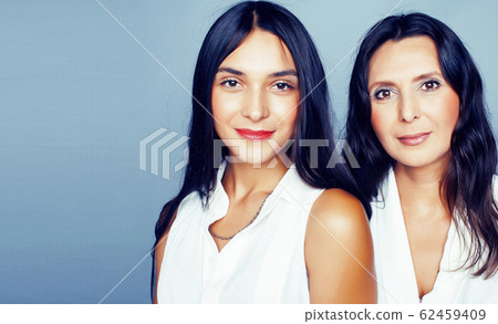 cute pretty teen daughter with mature mother hugging, fashion style brunette, lifestyle people concept cute pretty teen daughter with mature mother hugging, fashion style brunette, lifestyle people concept 62459409