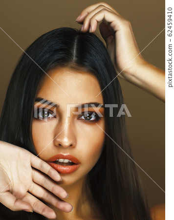 cute happy young indian woman in studio closeup smiling, fashion beauty cute happy young indian woman in studio closeup smiling, fashion beauty 62459410