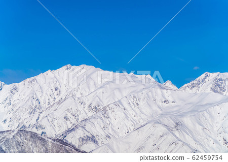 Hakuba Sanzan in winter seen from the Shirasawa Pass [Nagano Prefecture] 62459754