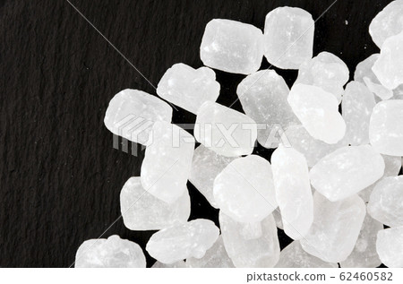 Ice sugar on black plate Ice sugar on black plate 62460582