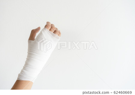 Close up hand painful with bandage on white background 62460669