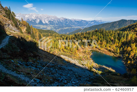 Calm autumn Alps mountain lake with clear Calm autumn Alps mountain lake with clear 62460957
