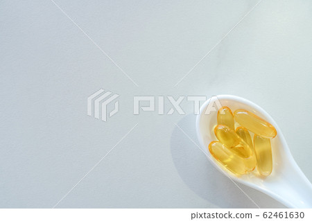 Top view of natural vitamin supplement on white 62461630