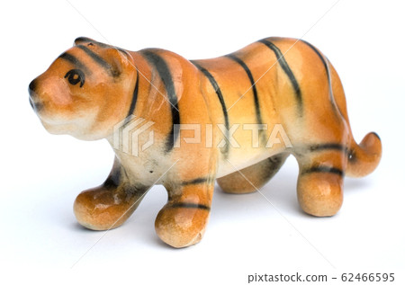 The tiger clay dolls for decoration, one of the souvenir from the local village in Lampang province of Thailand. 62466595