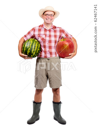 Gardener holding water melon and red apple; 62467141