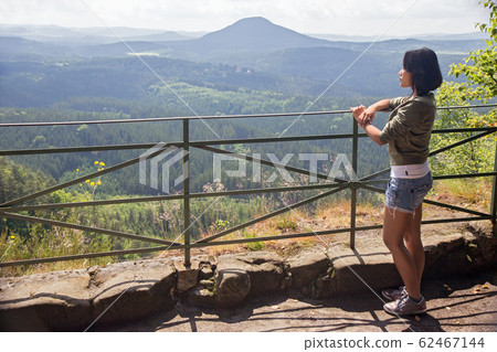woman watching view of the valley 62467144