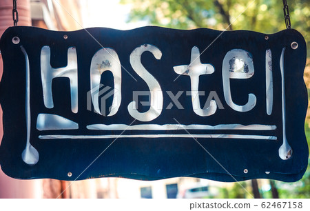 Retro aged blue signboard with inscription hostel Retro aged blue signboard with inscription hostel 62467158