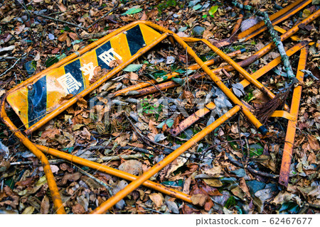 Broken road barrier 62467677