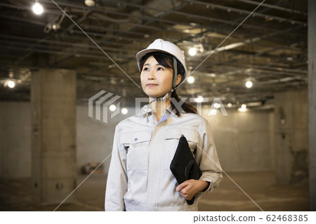 Female construction work blueprints Female construction work blueprints 62468385