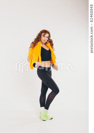 A girl in a tracksuit on a white background. Healthy lifestyle concept, sports uniforms, world Cup, gym, specialized clothing, black uniforms A girl in a tracksuit on a white background. Healthy lifestyle concept, sports uniforms, world Cup, gym, specialized clothing, black uniforms 62468948