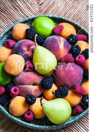 Plate of various summer fresh ripe berries and Plate of various summer fresh ripe berries and 62472383