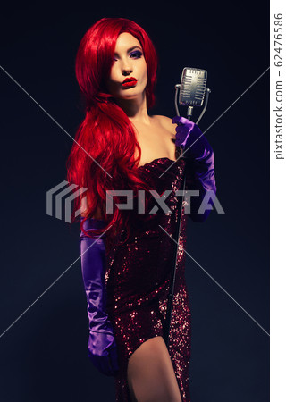 Young romantic redhead woman with very long hair 62476586