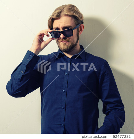 Portrait of a good looking young man with Portrait of a good looking young man with 62477221