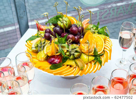 Fruit slicing, table setting 62477502