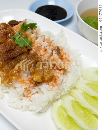 BBQ Pork and Crispy Pork with Rice. Closeup Useful as background for design-works. closeup (Thai food) BBQ Pork and Crispy Pork with Rice. Closeup Useful as background for design-works. closeup (Thai food) 62477683
