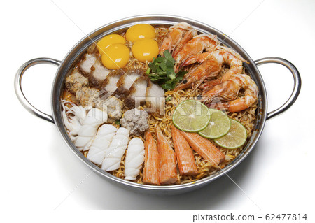 Pot of spicy instant noodles isolated on white background. Topping with eggs, lemon, pork , crispy pork, sausage , shrimp, squid, crab and coriander Pot of spicy instant noodles isolated on white background. Topping with eggs, lemon, pork , crispy pork, sausage , shrimp, squid, crab and coriander 62477814