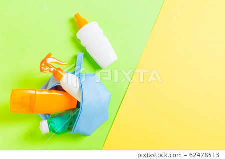 Top view of female cosmetics bag full of suncream Top view of female cosmetics bag full of suncream 62478513