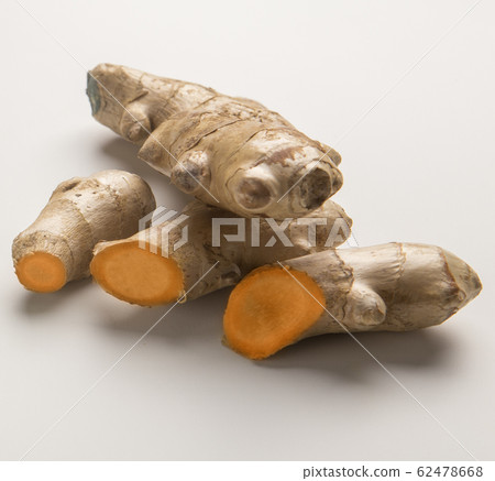 Cutting or sliced turmeric curcuma root on white Cutting or sliced turmeric curcuma root on white 62478668