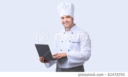 Chef Man Using Laptop Standing On White Studio Background, Panorama 62478705