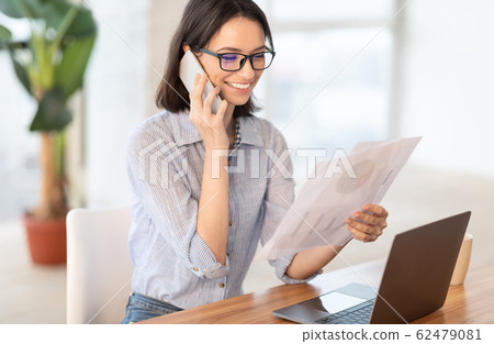 Portrait of european business woman making phone call 62479081