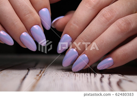 manicure with long nails on a trendy texture 62480383
