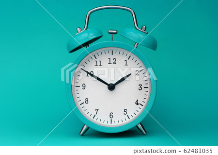 Modern alarm clock turquoise closeup object 62481035