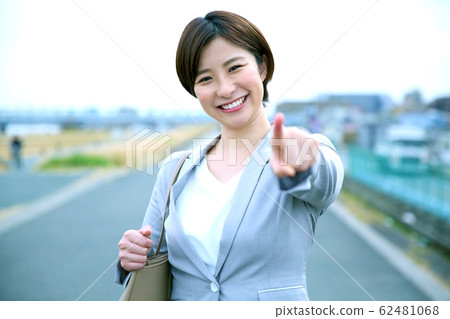 An image of a business woman cheering 62481068