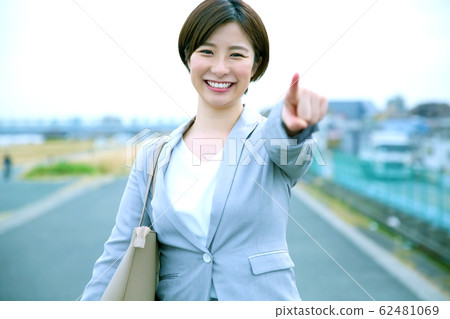 An image of a business woman cheering 62481069