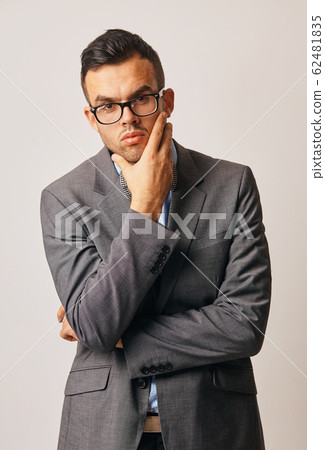 a portrait of worried young businessman in suit 62481835