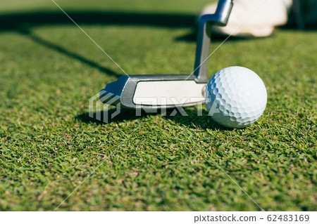 Close Up of Golf club and ball in grass. Close Up of Golf club and ball in grass. 62483169